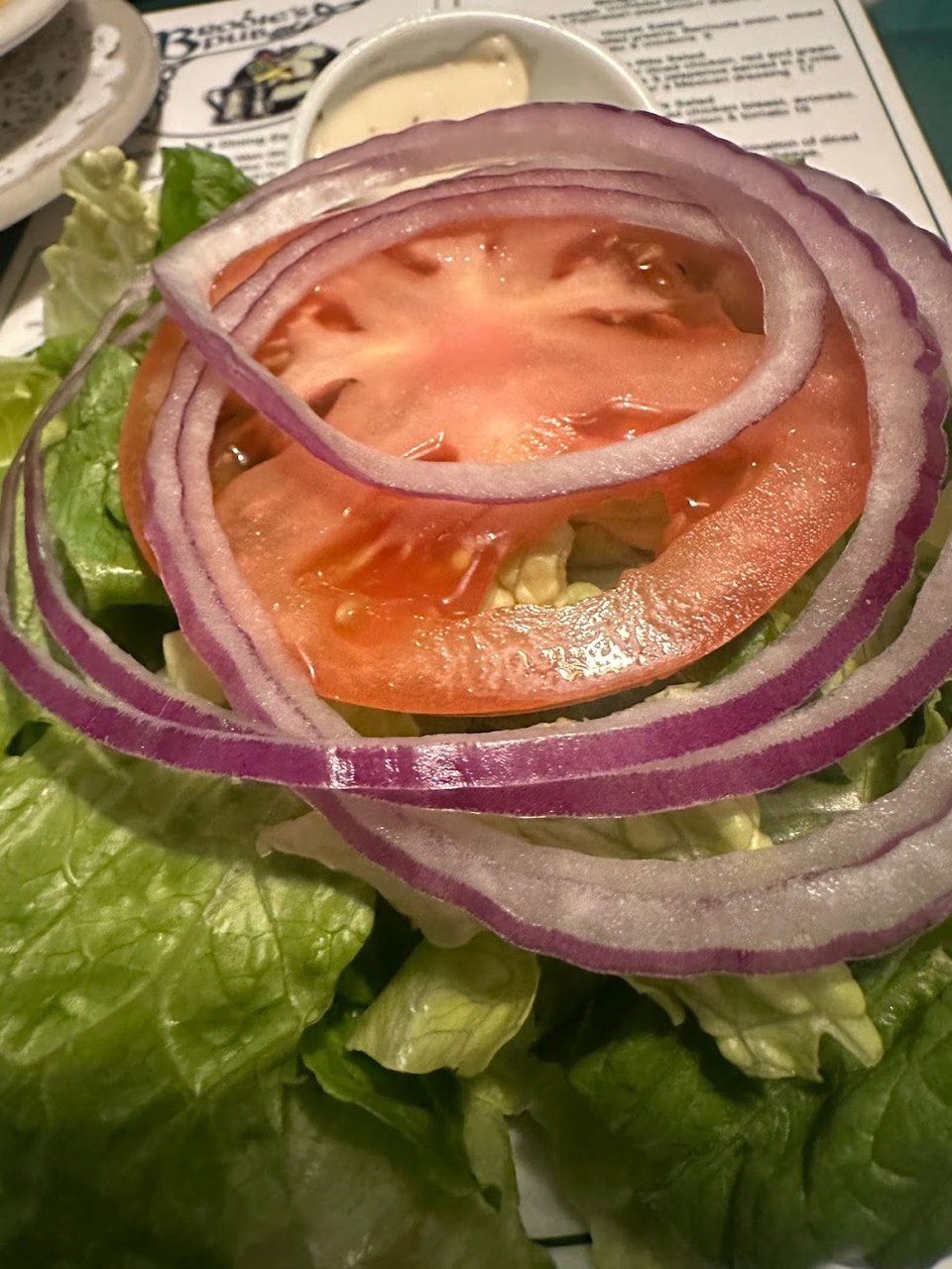 Food menu featuring salads and classic pub plates.