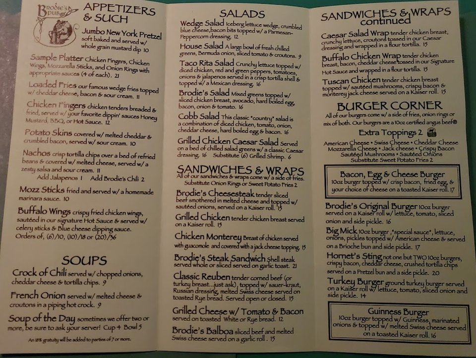 Food menu featuring salads and classic pub plates.